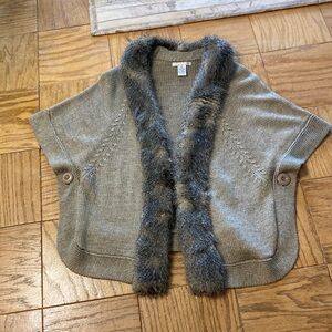 Wool cape with faux fox trim.